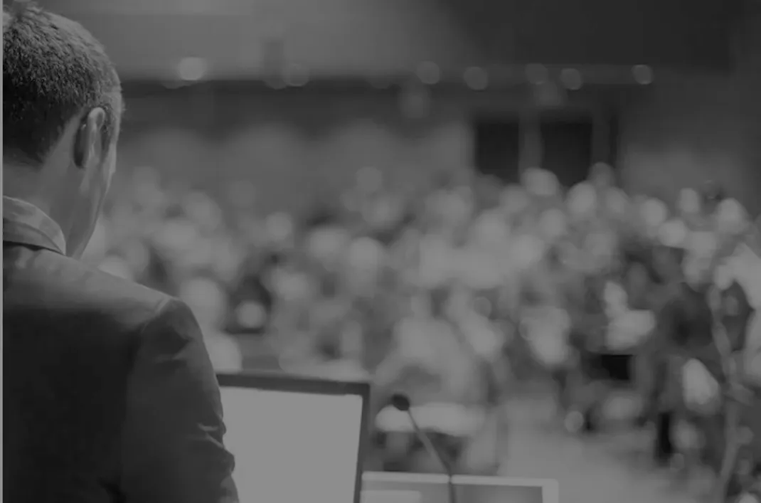 Surgeon presenting at a conference